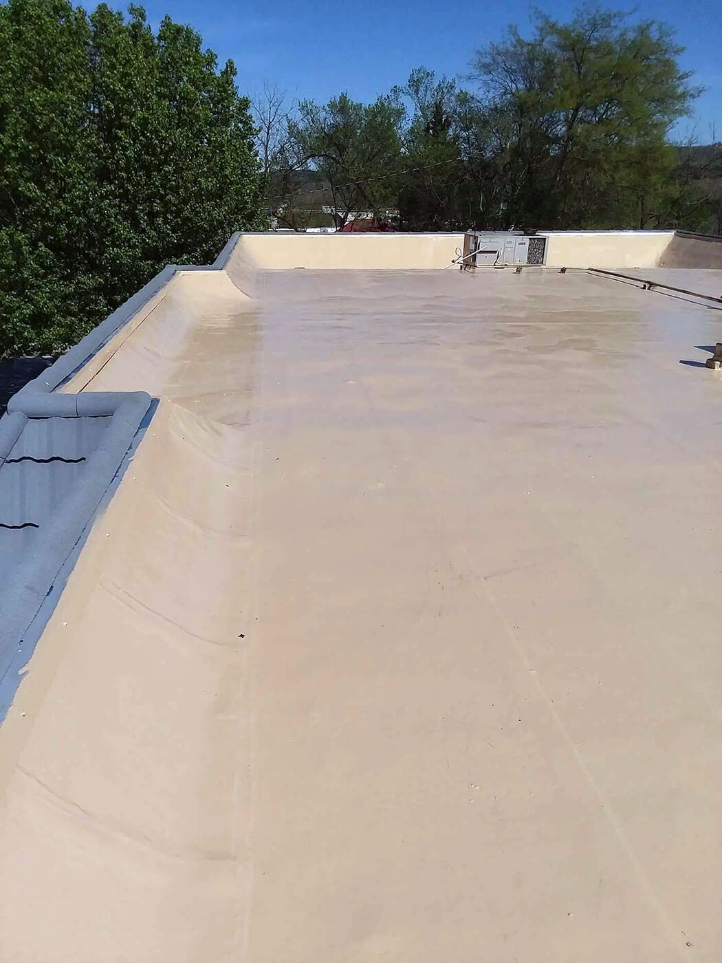 Low-slope commercial roof with single-ply membrane in Northern Arkansas